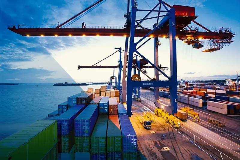 AEB Dammam Containers branded container lifted by a port gantry crane
