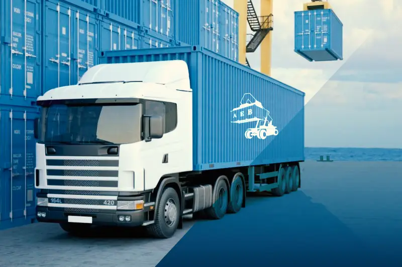 AEB truck carrying a branded blue container on the road