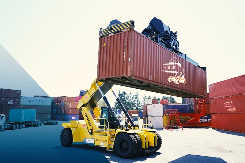AEB Dammam Containers branded blue container on a delivery truck